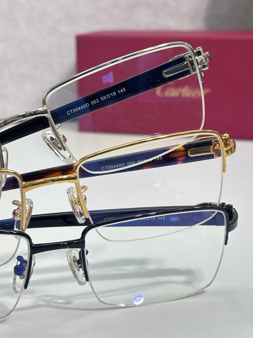 Cartier glasses with dark blue and tortoiseshell accents, clear rectangular lenses
