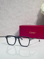 Blue rectangular eyeglasses with clear lenses and gold accents