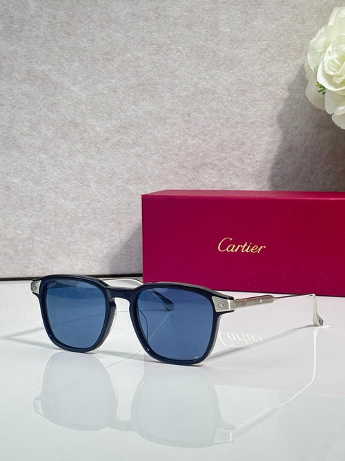 Blue eyeglasses with dark blue lenses, square frames, and gold-tone temple accents.