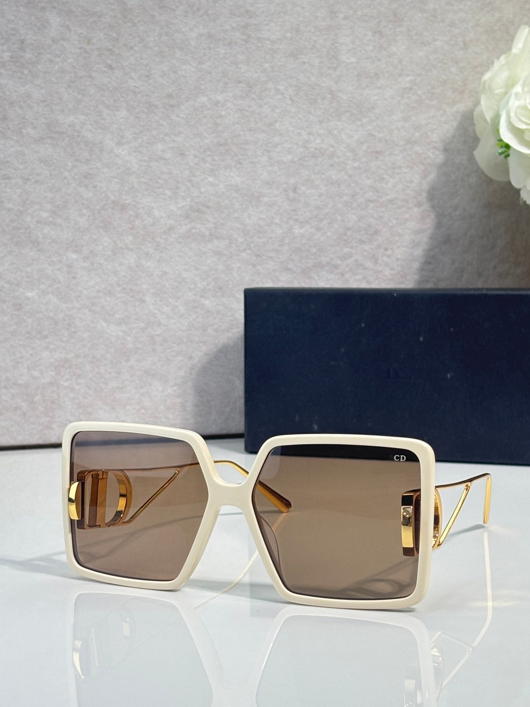 Cream square sunglasses with brown gradient lenses and gold-tone metal hardware