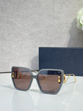 Dior sunglasses with dark blue thick frames and amber-tinted square lenses