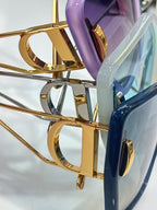 Dior sunglasses gold-tone hinge and temple detail with tinted lens edge