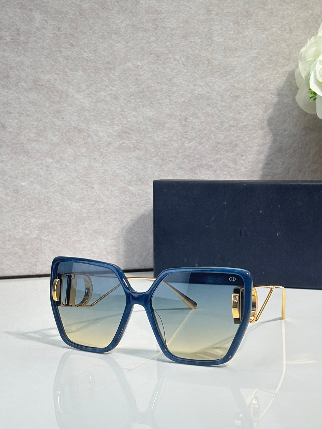 Dior square sunglasses with deep blue frame and light smoky lenses