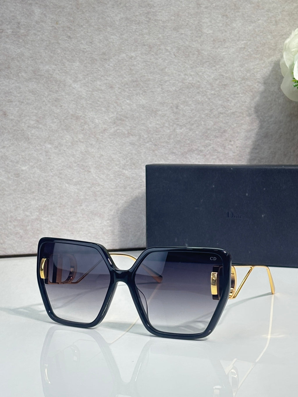 Dior square sunglasses with dark frame and smoky blue gradient lenses