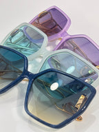 Dior sunglasses set: stacked mint, blue, and purple frames with tinted lenses