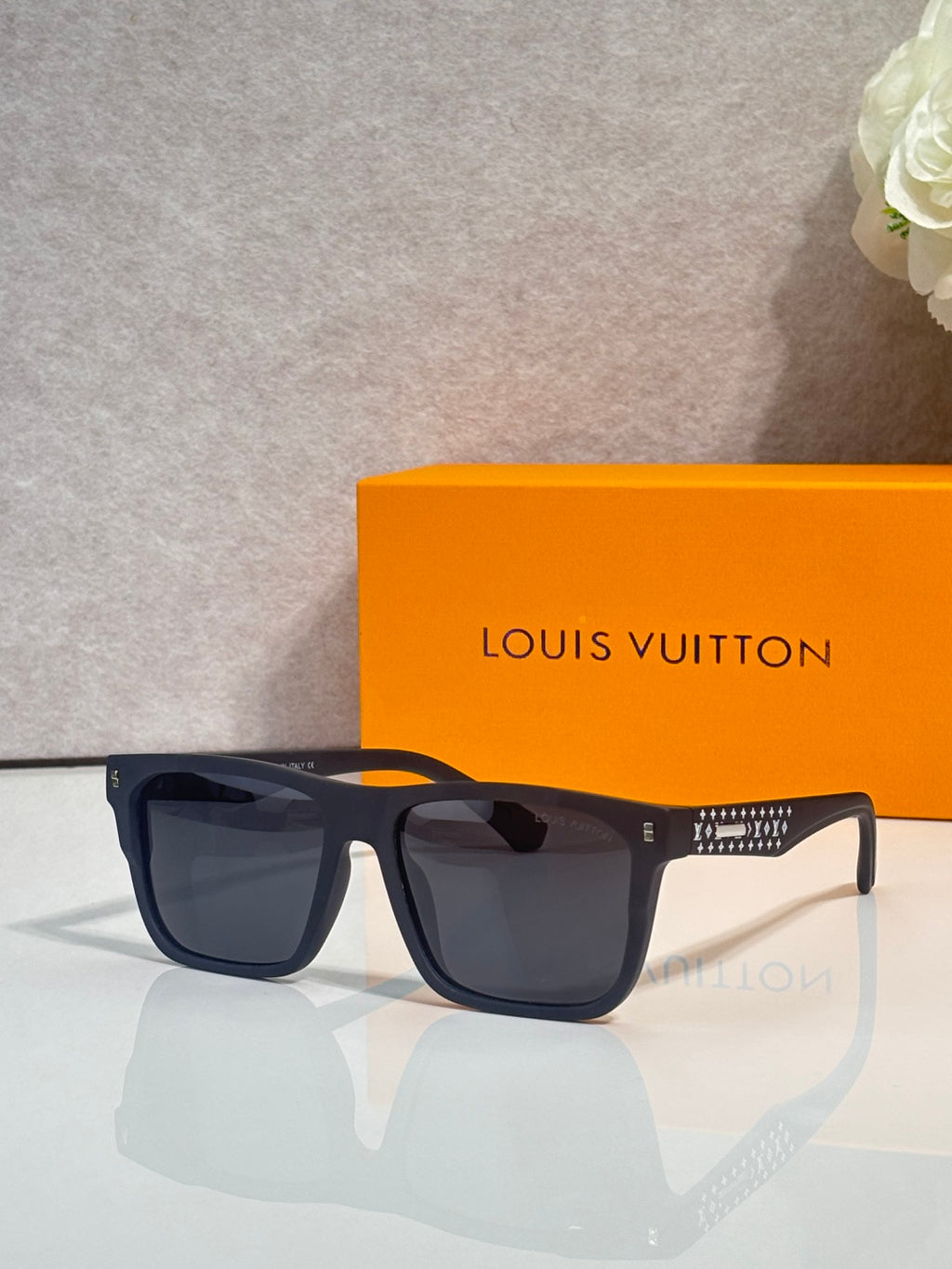 Louis Vuitton square sunglasses with dark navy frames and dark tinted lenses
