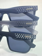 Louis Vuitton sunglasses with navy frames and LV monogram patterned temples