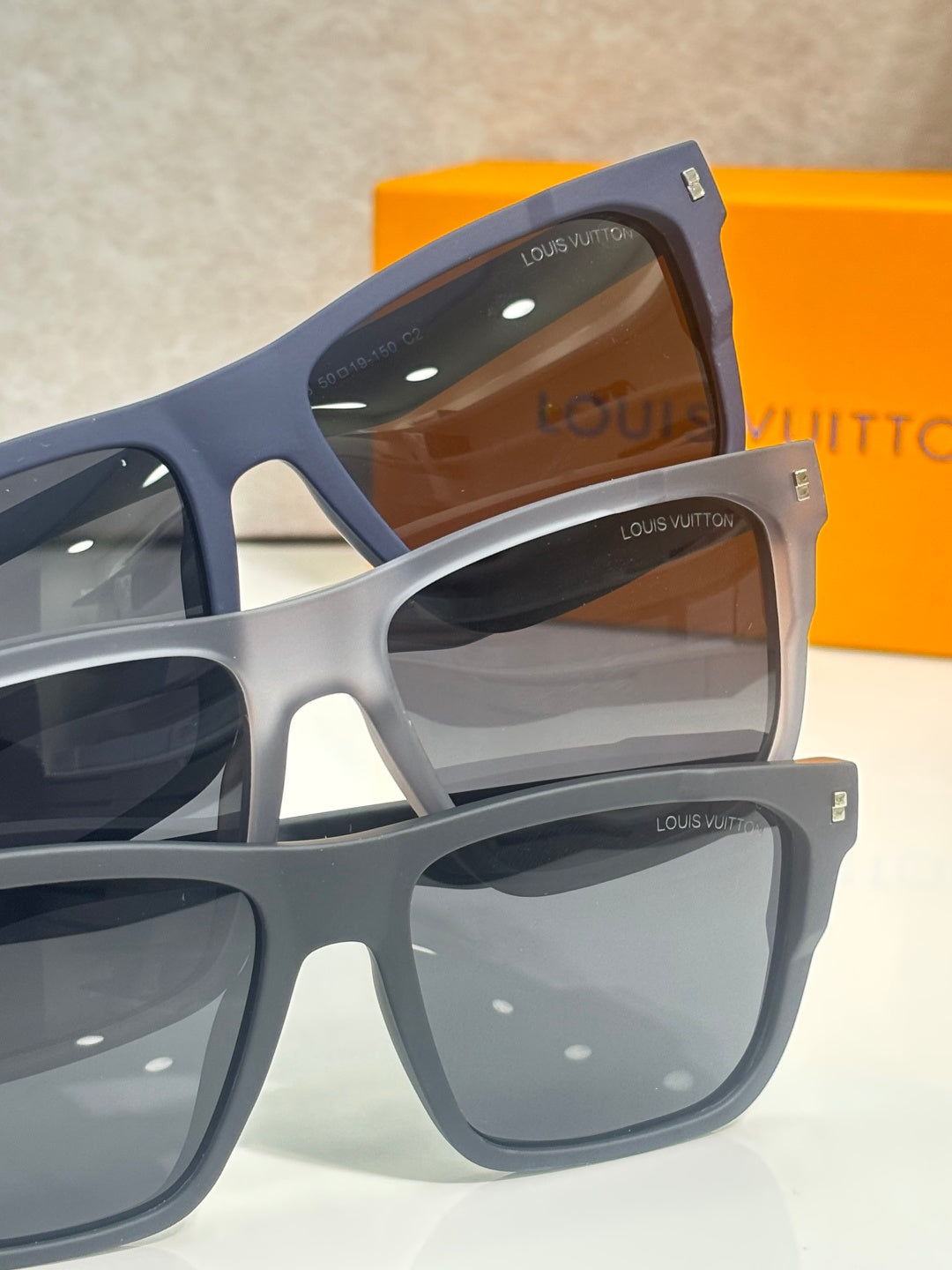 Louis Vuitton sunglasses set with navy and light gray square frames