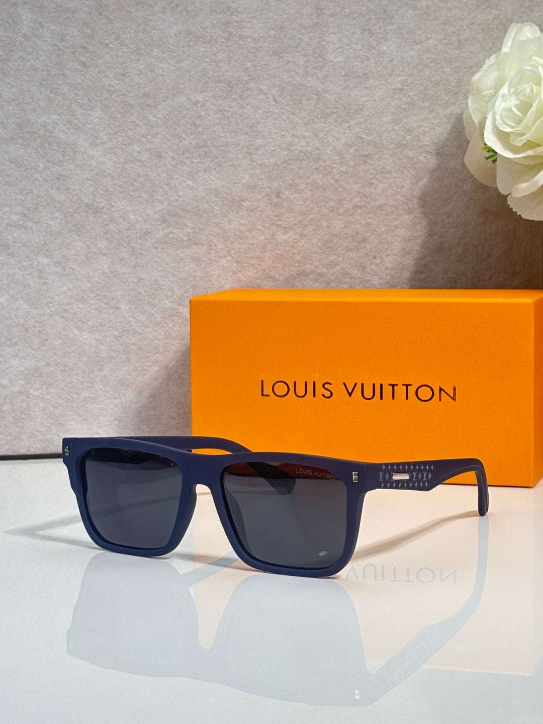 Louis Vuitton square sunglasses with dark navy frames and black lenses