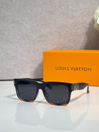 Louis Vuitton sunglasses with dark gray frames and black tinted lenses, side logo detail