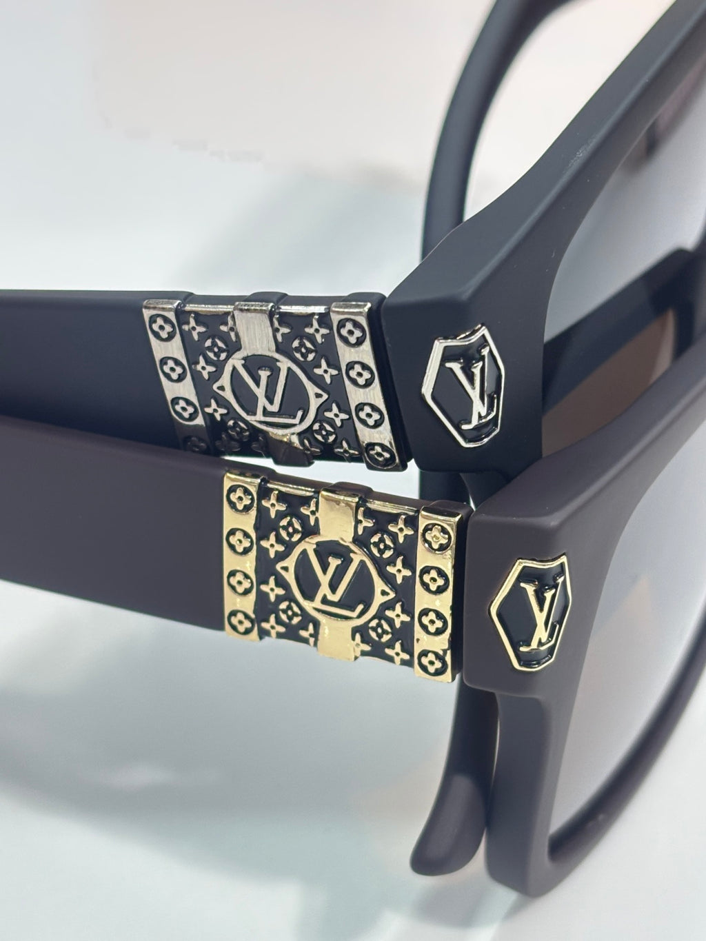 Louis Vuitton sunglasses with monogram trim on the temples and metal LV logo plaques