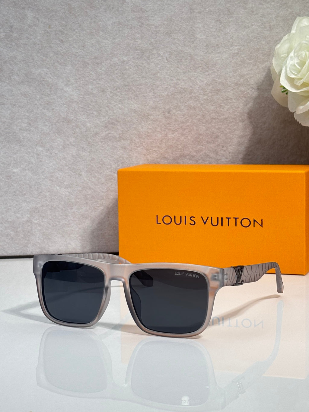 Louis Vuitton sunglasses with silver frame and dark square lenses