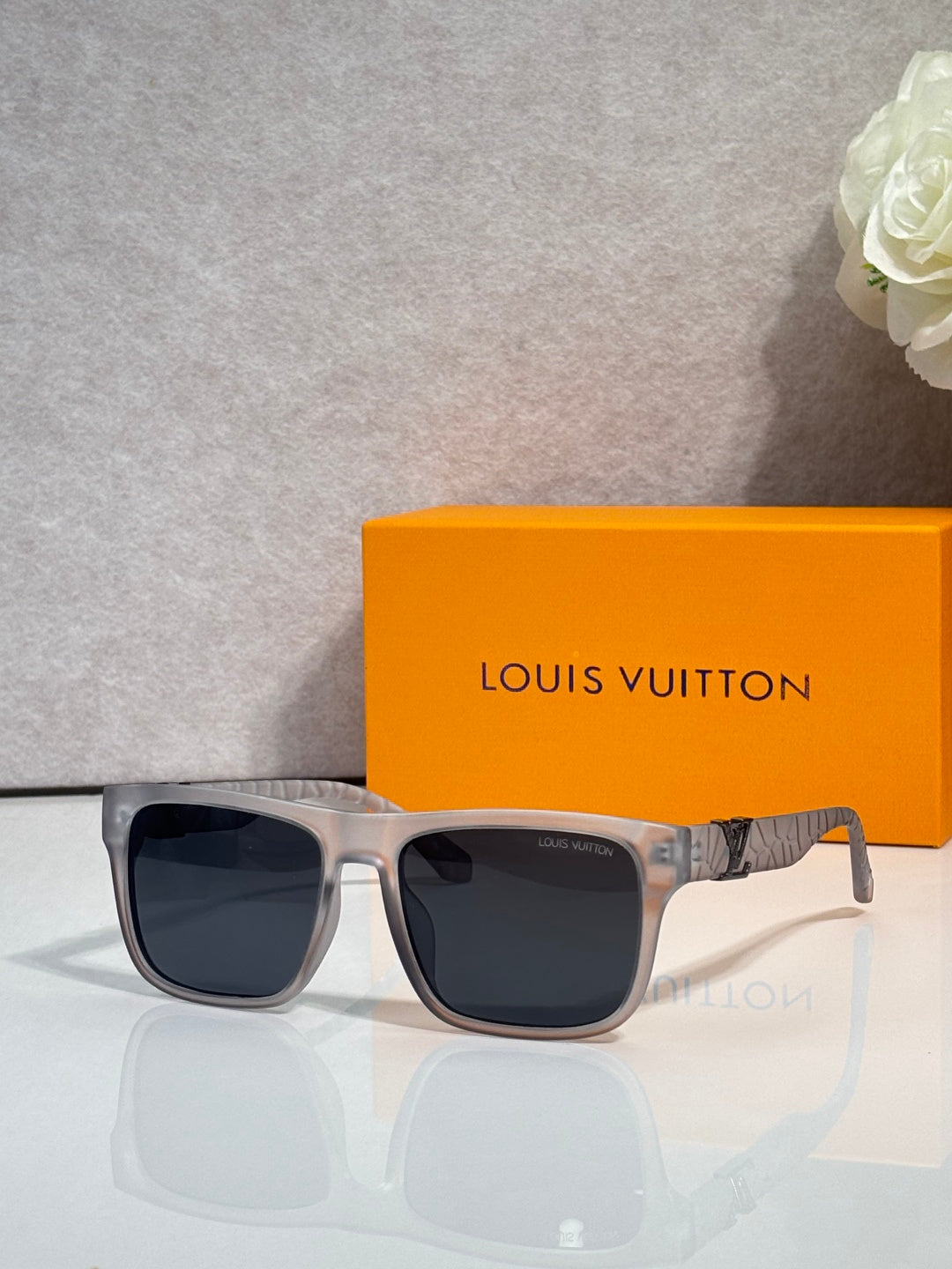 Louis Vuitton sunglasses with silver frame and dark square lenses
