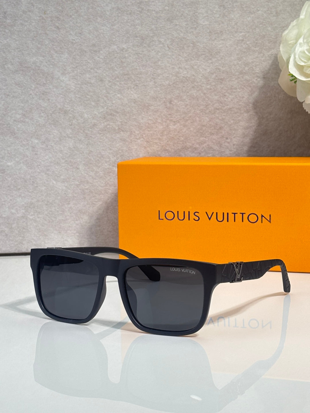 Louis Vuitton sunglasses with dark square lenses and navy frames