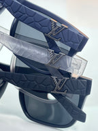 Louis Vuitton sunglasses temple detail with textured blue strap and metal logo