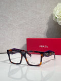 Prada rectangular eyeglasses with dark tortoise frames and clear lenses