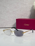 Cartier sunglasses with gold frame, dark blue lenses, black temple tips