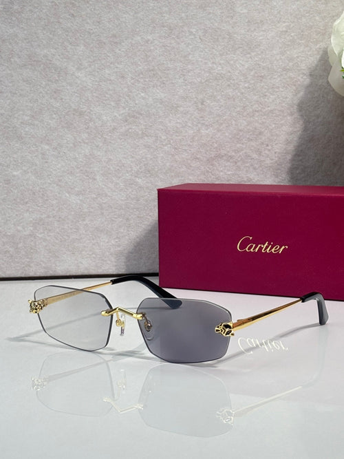 Cartier sunglasses with gold frame, dark blue lenses, black temple tips