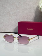 Cartier sunglasses with gold frame, light pink lenses, black temple tips