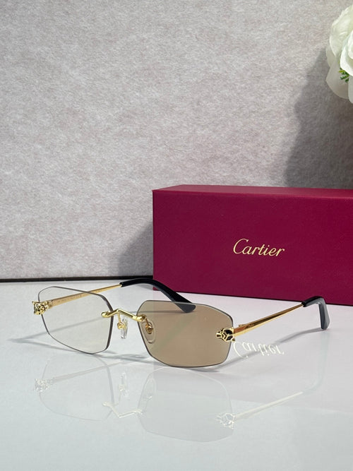 Cartier sunglasses with gold frame, amber-tinted lenses, black temple tips