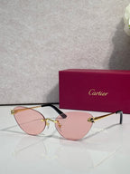 Cartier glasses with gold frame, pink lenses, and black temples