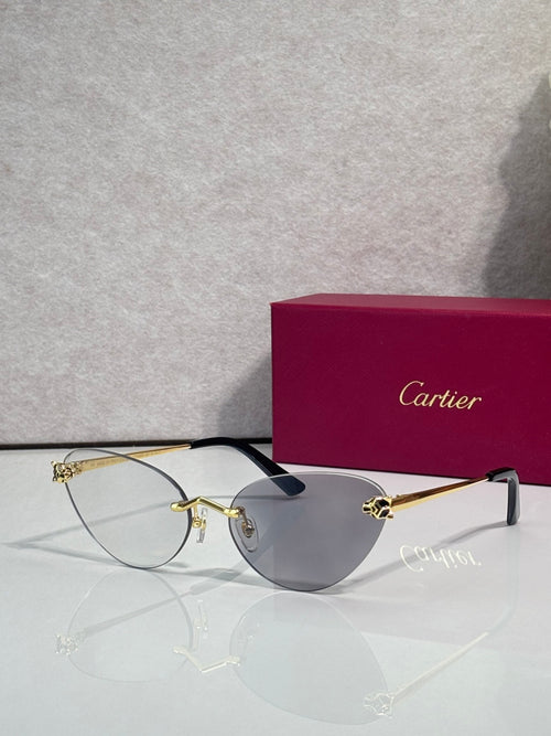 Cartier glasses with gold frame, gray lenses, and black temples