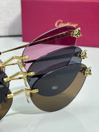 Cartier glasses angled view with gold frame and dark lenses, visible hinge details