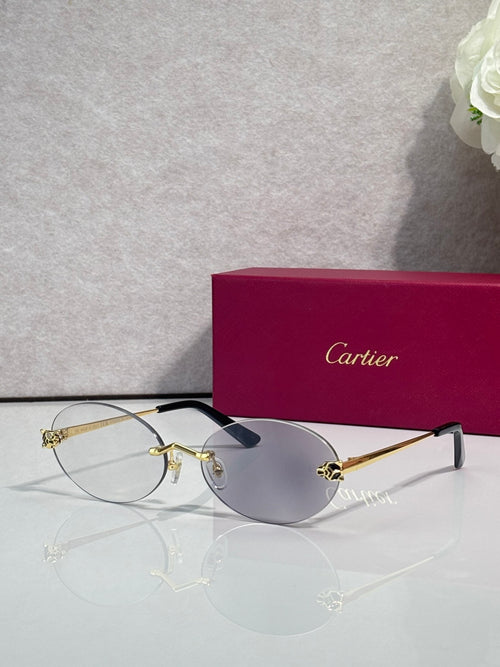 Cartier round sunglasses with clear frames, gold temples, gray tint lenses