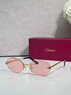 Cartier round sunglasses with clear frames, gold temples, pink tint lenses