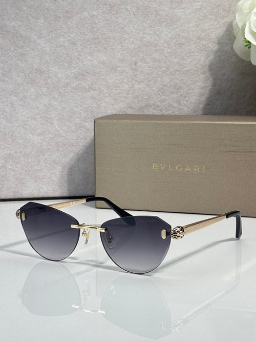 Sunglasses with dark blue tinted lenses, black frame, and gold metal arms