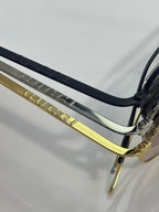 Gucci sunglasses close-up of hinge and metal temple with engraved detailing