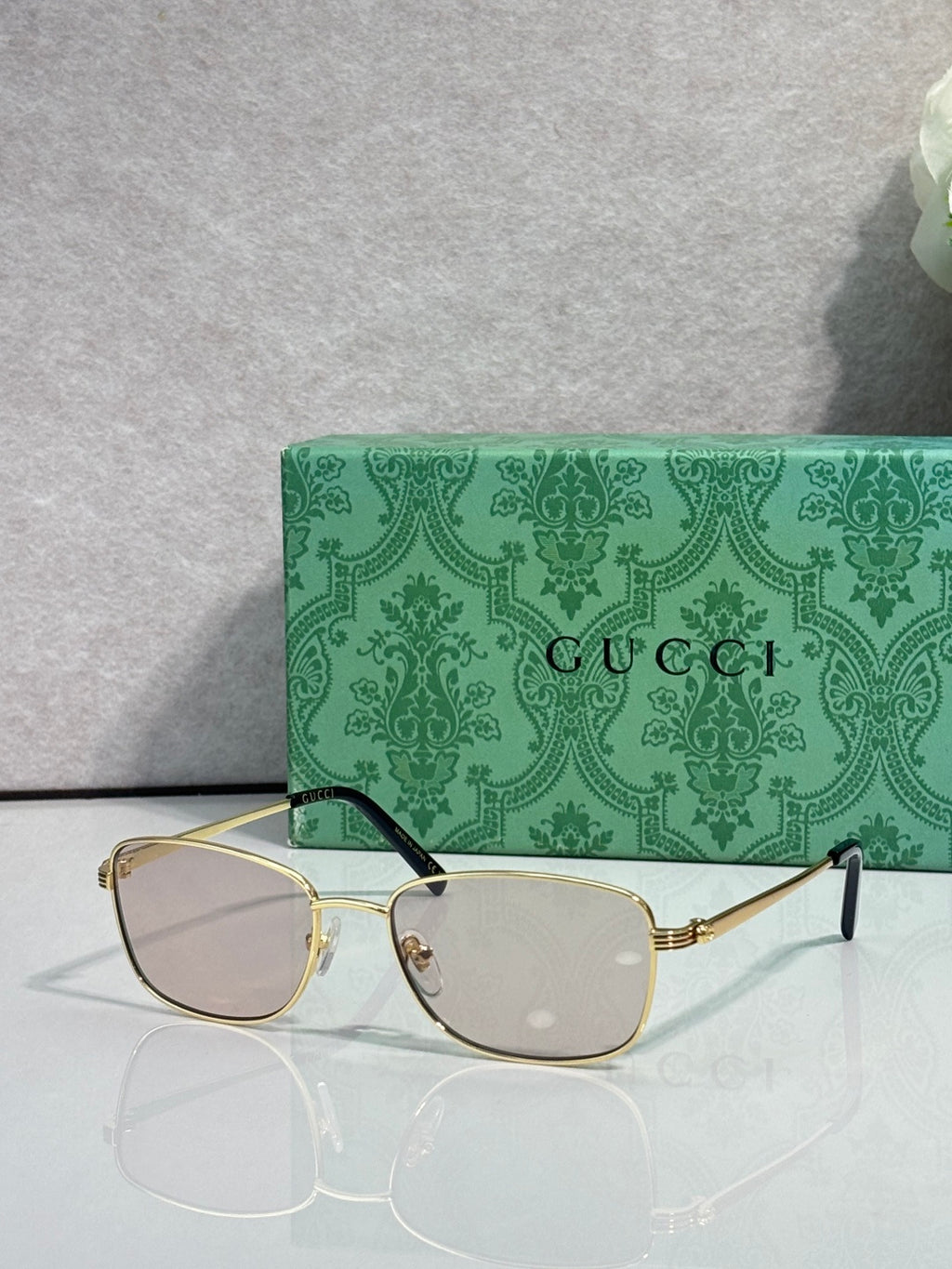 Gucci sunglasses, gold frame with light brown lenses and black temples