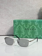 Gucci sunglasses, gray lenses in gold frame with black temples