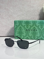 Sunglasses with dark lenses and black frame, straight metal temples