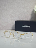 Chrome-finish round eyeglasses with gold metal frames and clear lenses
