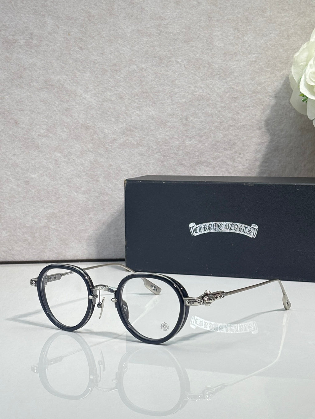 Chrome-finish round eyeglasses with blue metal frames and clear lenses