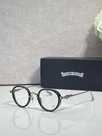Chrome-finish round eyeglasses with blue metal frames and clear lenses