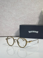Chrome-finish round eyeglasses with tan/gold frames and clear lenses