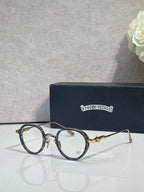 Chrome-finish round eyeglasses with dark frames and clear lenses