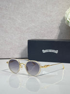 Chrome round glasses with light tinted lenses and gold frame