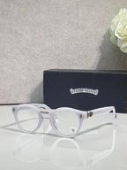 White round eyeglasses with gold-tone hinges and clear lenses