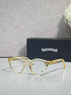 Gold round eyeglasses with clear lenses and gold-tone bridge details