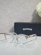 Silver round eyeglasses with gold-tone hinges and clear lenses