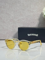 Gold round sunglasses with yellow tinted lenses and chrome arms