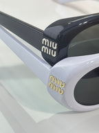 MiuMiu sunglasses close-up: white frame with black temple and miumiu logo