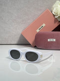 MiuMiu sunglasses with white frame and dark round lenses