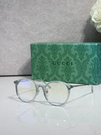Gucci eyeglasses with clear lenses and silver metal frame, round corners