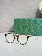 Gucci eyeglasses with clear lenses and dark brown plastic frame