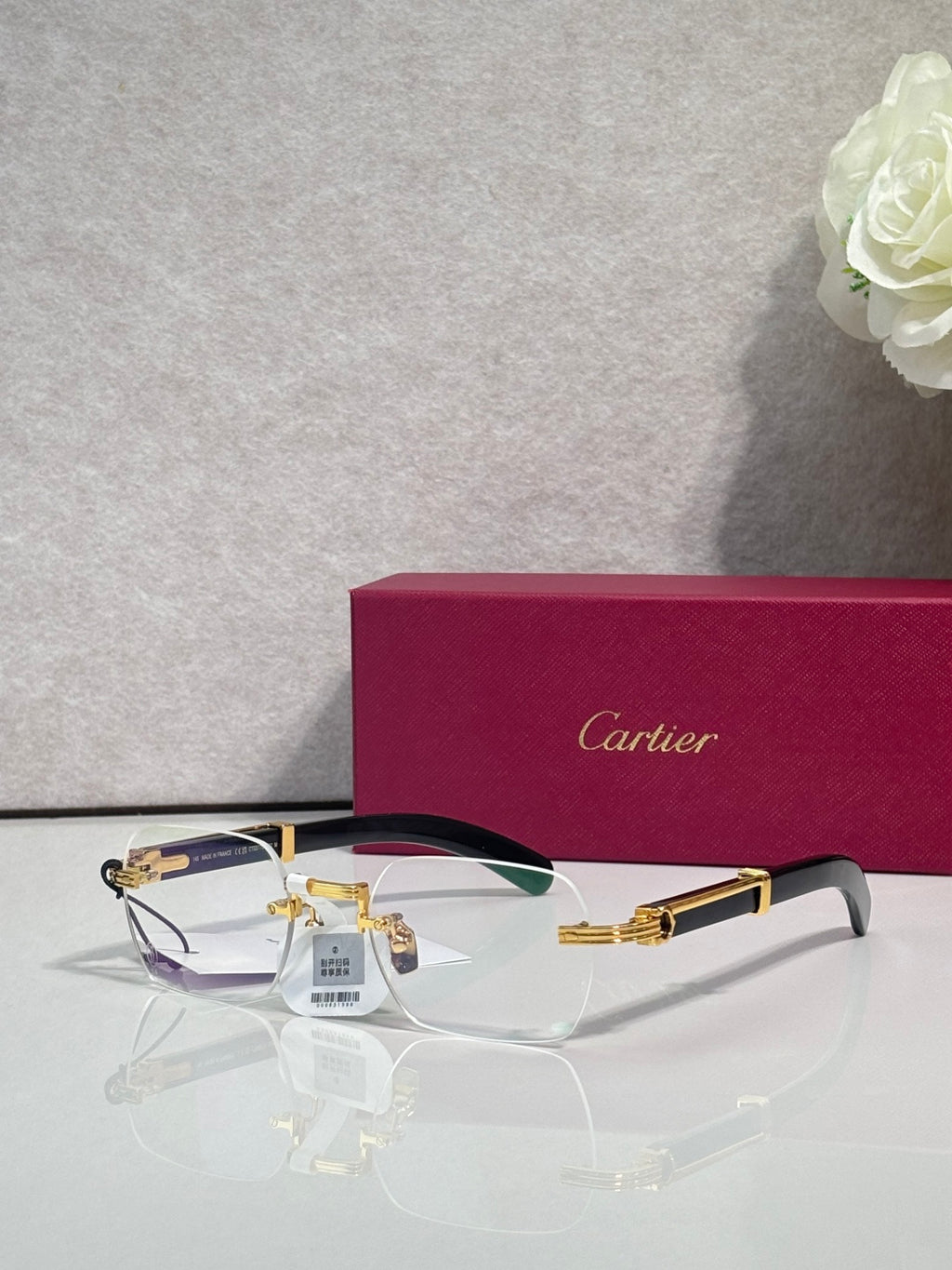 Eyeglasses with clear lenses and gold metal frame, dark top accent