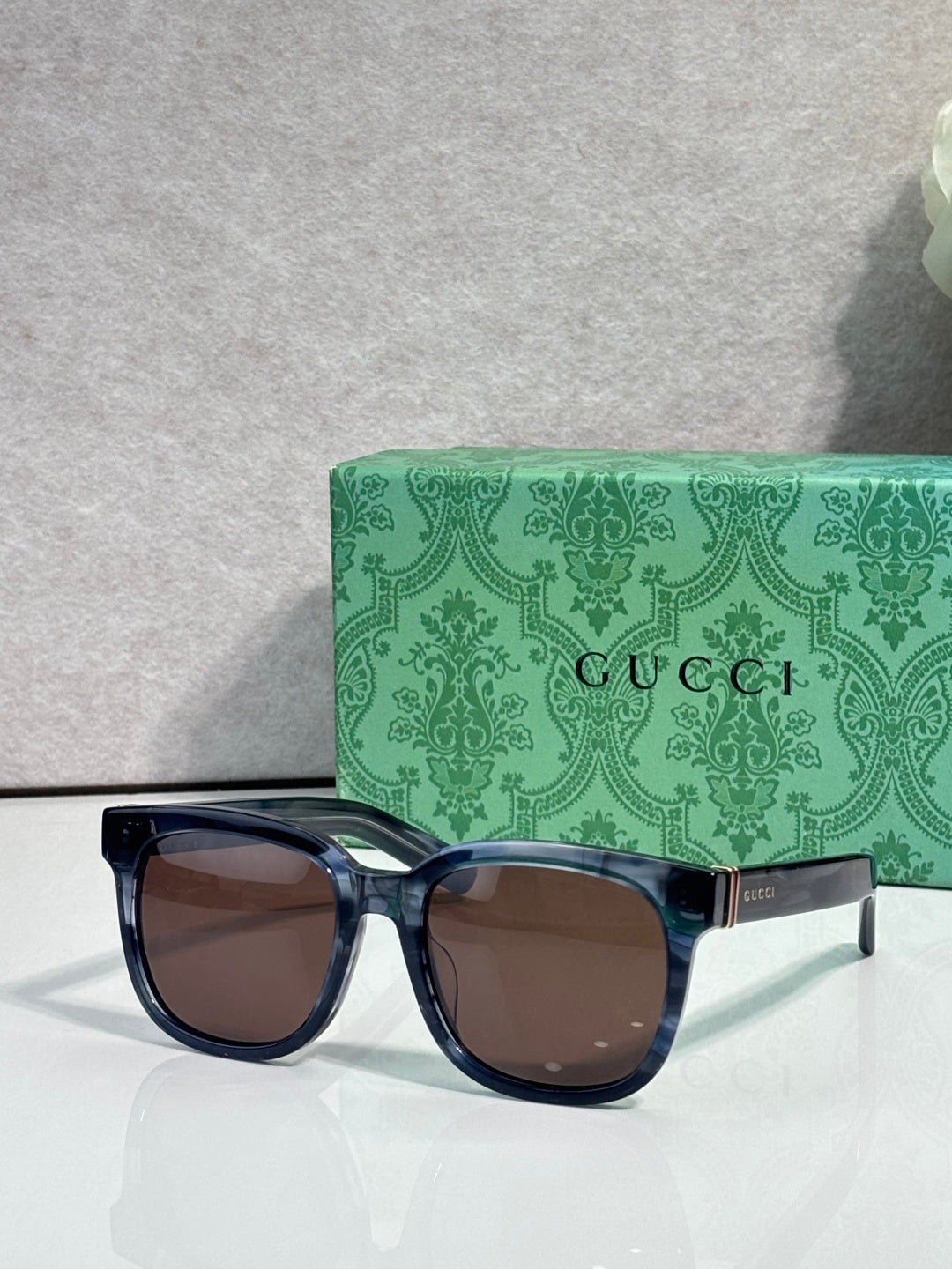 Gucci sunglasses, black-blue frame with brown-tinted lenses